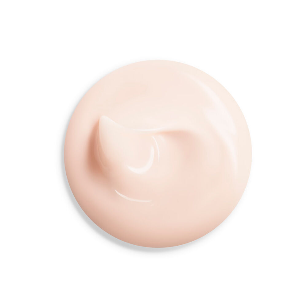 Close-up of smooth pink cream texture for Shiseido Vital Perfection Day Cream skincare